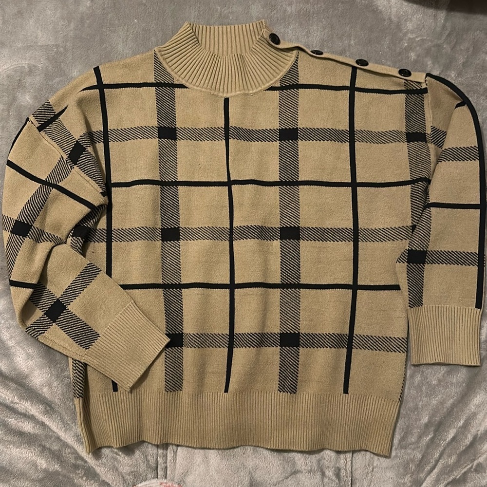 sage green patterned sweater with button across right shoulder
